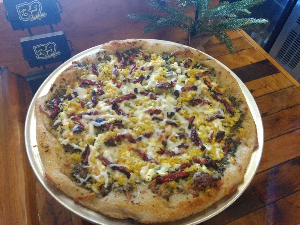 Pesto Goat Cheese Corn Sun-Dried Tomato Pizza
